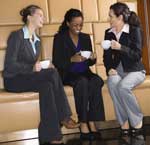 Businesswomen Networking Business women networking over coffee